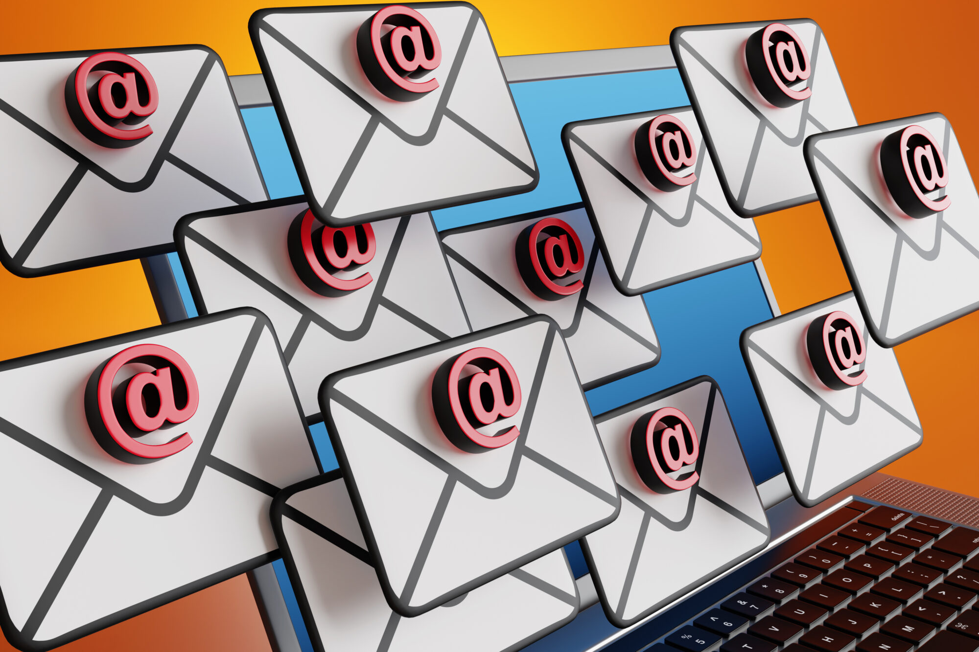 Email sign on an envelop floating in front of a laptop