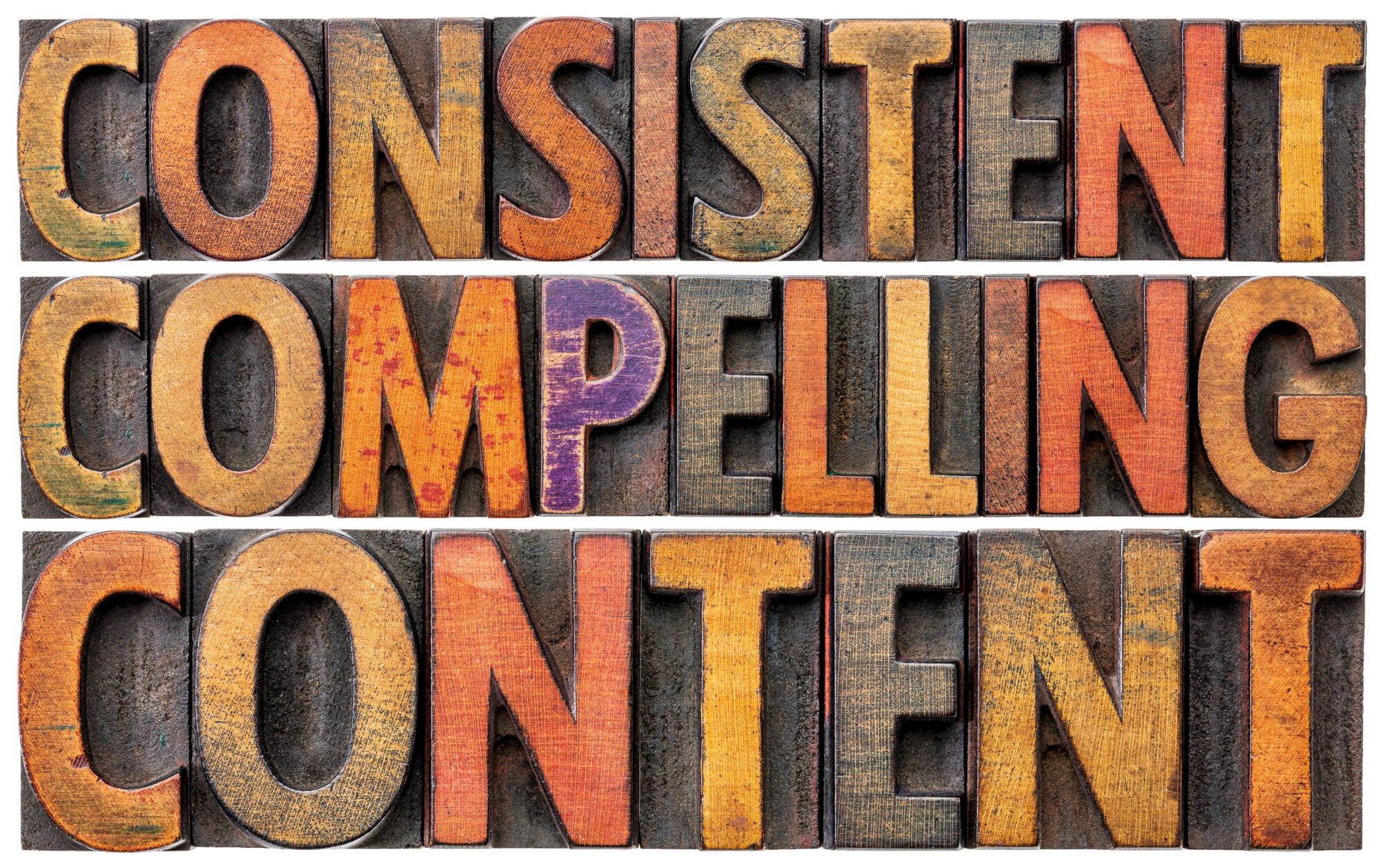 Wood blocks spell out "consistent, compelling content"
