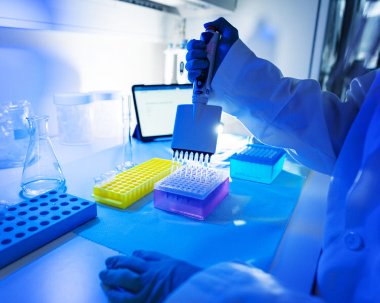 Researcher at work in DNA genetic laboratory: virus and pathogen detection