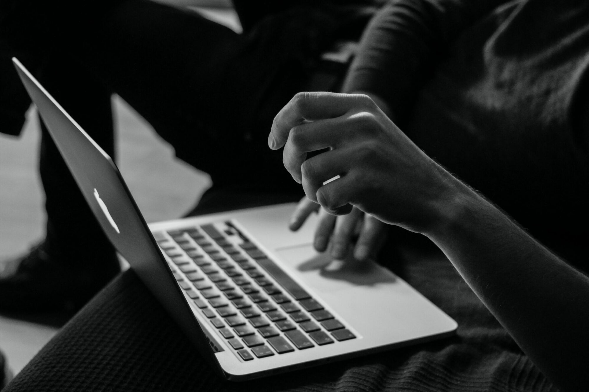 Person using a laptop to illustrate accessibility on websites