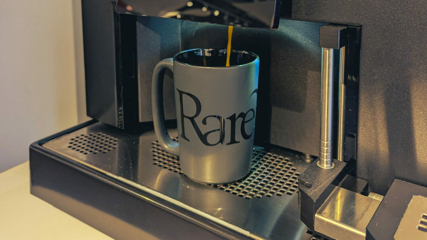 Filling up a Rare Bird mug in the Rare Bird office, courtesy of our new coffee machine
