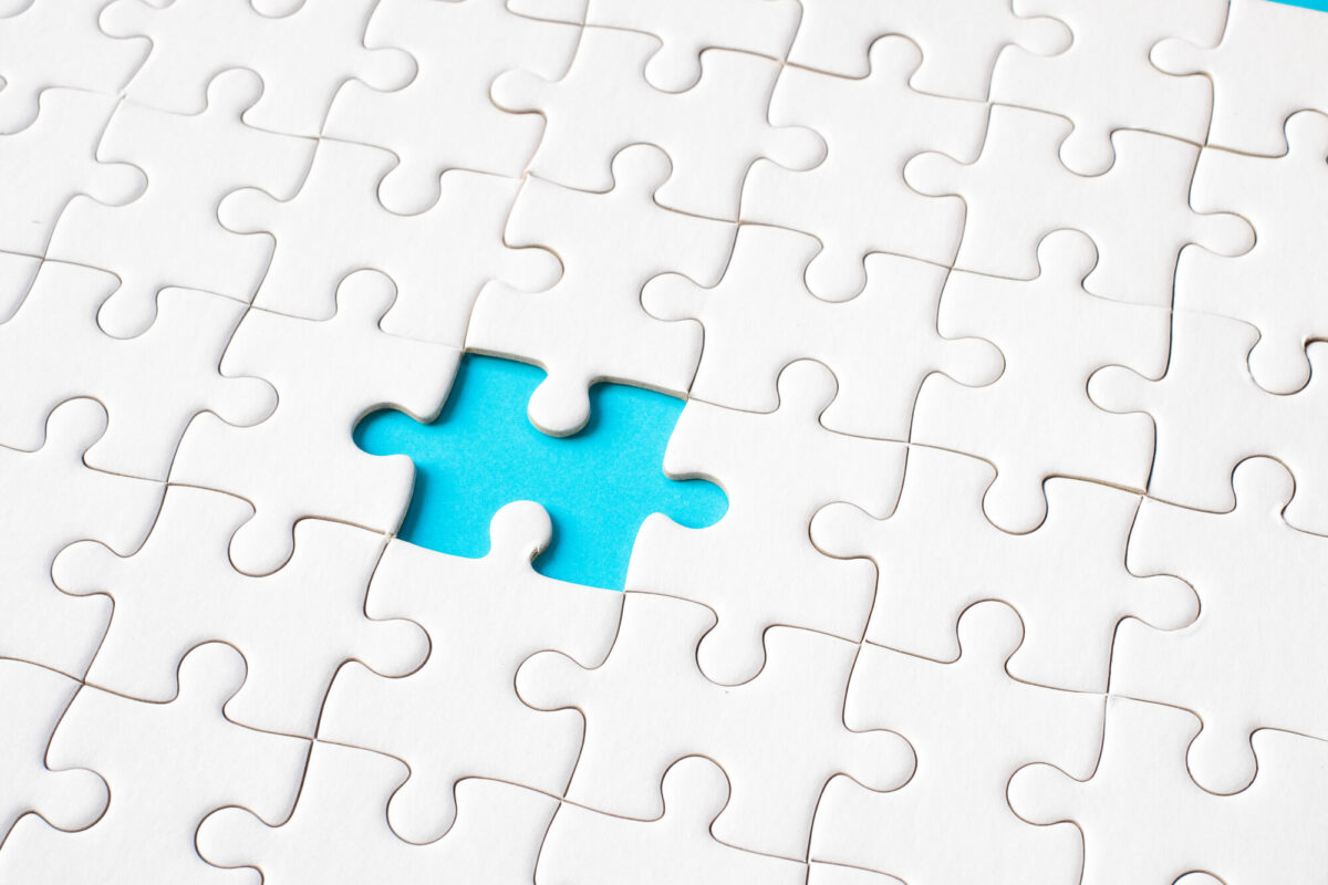 White jigsaw puzzle on blue background (blue gap)
