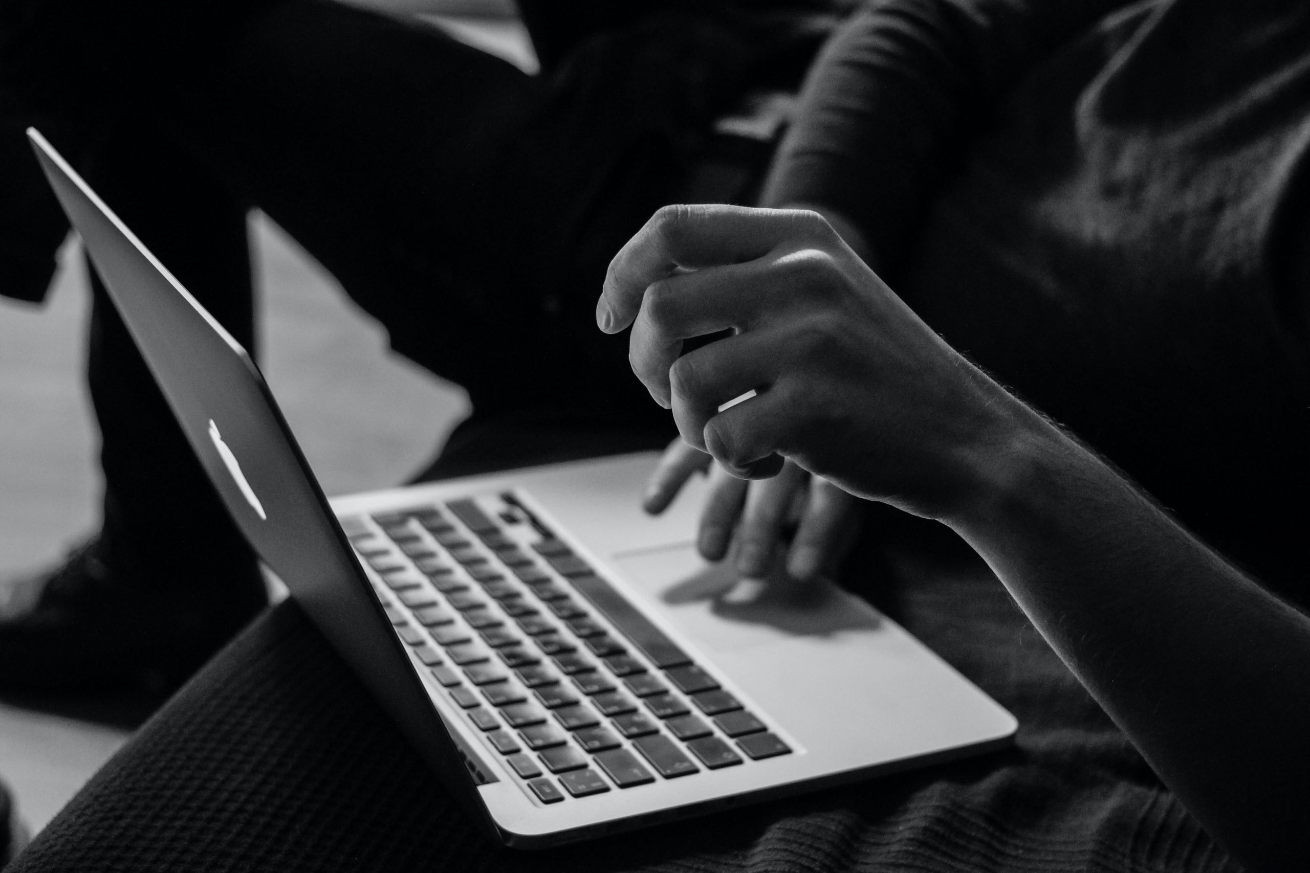 Person using a laptop to illustrate accessibility on websites